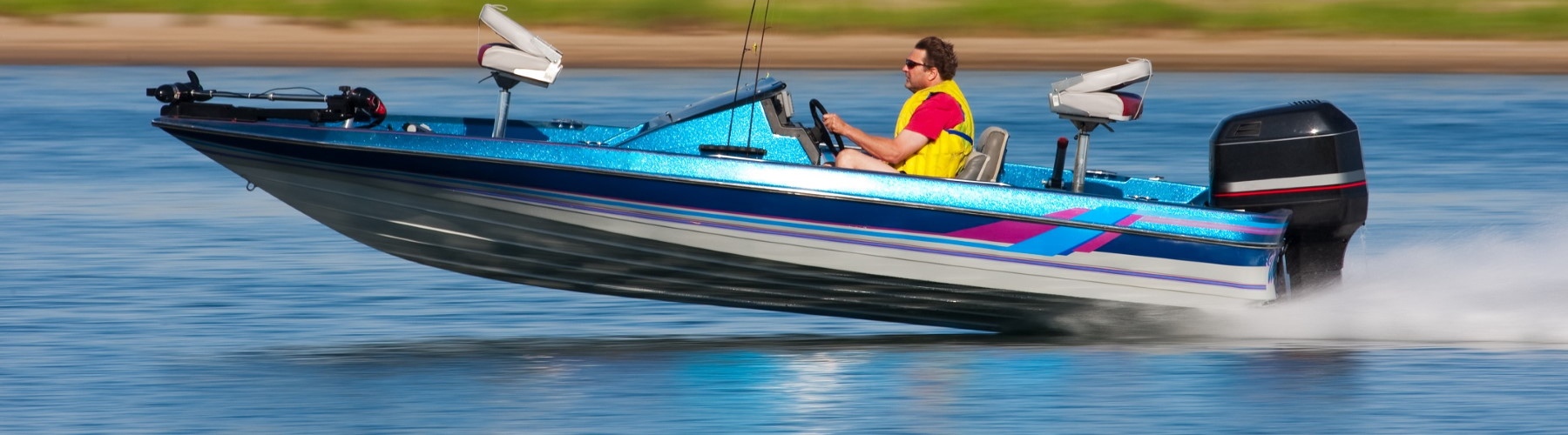 man in speedboat on a lake